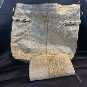 Coach Gold Shoulder Bag with Slouchy Design and Decorative Zippers